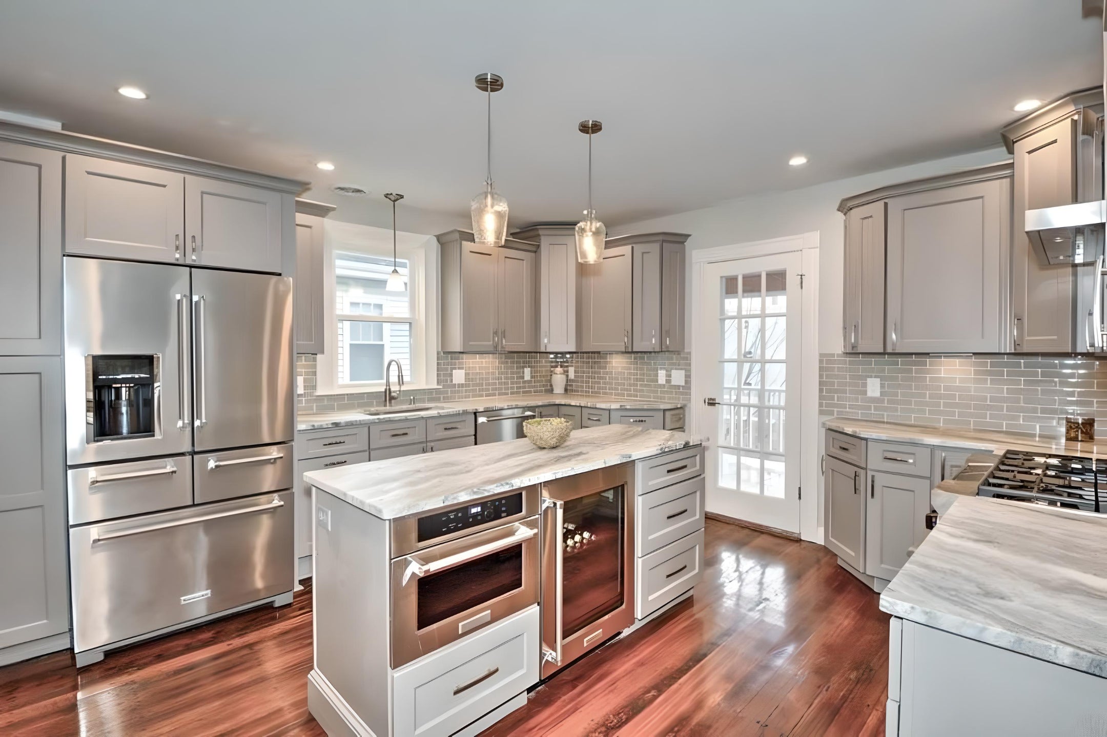 Modern Kitchen Remodels with Shaker Cabinets by L&C Cabinetry